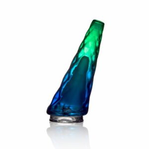 WIIDZ® Hawaii puffco peak pro glass attachment facing west. The glass attachment has geometric design, diamond cut styled out chamber with transient green blue color.