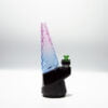 WIIDZ® Indiglow puffco peak pro glass attachment installed on puffco peak, facing west. The glass shaped like the original puffco peak pro glass but with diamond cut surface and iridescent color of purple and blue, just like the Puffco Peak Indiglow Glass.