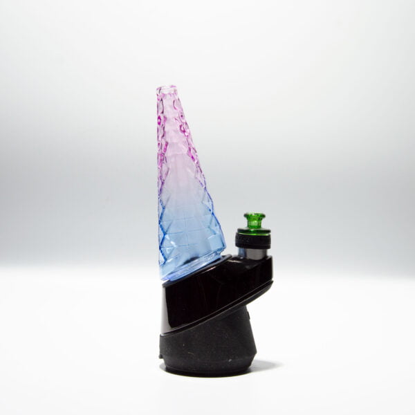 WIIDZ® Indiglow puffco peak pro glass attachment installed on puffco peak, facing west. The glass shaped like the original puffco peak pro glass but with diamond cut surface and iridescent color of purple and blue, just like the Puffco Peak Indiglow Glass.