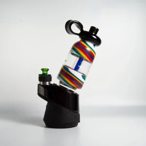 A Puffco Peak Pro glass attachment with a Wiidz flask installed, viewed from the west.