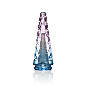 Puffco Peak with Wiidz glass attachment highlighted by an Indiglow light, positioned facing north, showcasing its unique design and functionality.