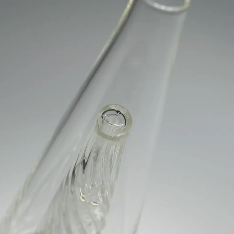 Close-up view of the Puffco Peak Glass Wiidz Original 2.0 with a clear center, showcasing its intricate design and high-quality craftsmanship.