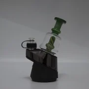 Puffco Peak Pro glass attachment WIIDZ Pico in vibrant green, expertly installed and oriented towards the east, showcasing its sleek design and functionality for enhanced dabbing experiences.