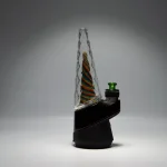 Puffco Peak Pro glass attachment featuring Wiidz design, installed in a westward orientation, showcasing its sleek style and functionality.