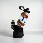 puffco peak pro glass attachment wiidz flask alt installed facing west.webp Puffco Peak Pro glass attachment installed on a Wiidz flask, oriented towards the west, showcasing the stylish and functional design for an enhanced smoking experience.