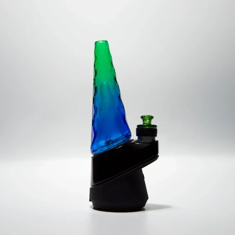 Puffco Peak Pro glass attachment from Wiidz Hawaii, beautifully designed and installed facing west, showcasing its sleek features and elegant craftsmanship in a scenic setting.