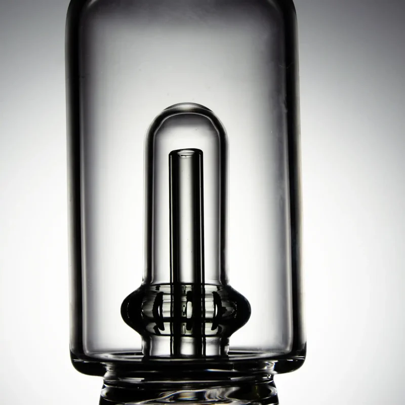 Close-up image of the Puffco Peak Pro glass attachment featuring Wiidz Tipsy in black with an inner tube design, highlighting its sleek and modern aesthetics.