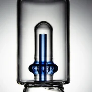 Close-up shot of the Puffco Peak Pro glass attachment featuring Wiidz Tipsy Blue inner tube, showcasing its vibrant color and intricate design.