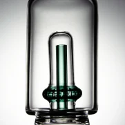 Close-up shot of Puffco Peak Pro glass attachment featuring Wiidz Tipsy green inner tube, highlighting its unique design and color for enhanced vaping experience.