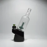 Puffco Peak Pro glass attachment with Wiidz Tipsy Green installed, oriented east, on a white background.