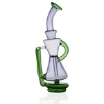 puffco peak glass attachment wiidz dark elf facing east.webp Puffco Peak glass attachment Wiidz Dark Elf, elegantly designed for enhancing your dabbing experience, showcased facing east in a visually appealing setup.