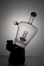 puffco peak glass attachment wiidz titan installed facing east backlit scaled 1.webp Puffco Peak glass attachment with Wiidz Titan installed, positioned facing east, beautifully backlit, scaled for a sleek appearance.