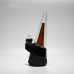 puffco peak glass wiidz original2.0 amber installed white bg facing east.webp Puffco Peak glass Wiidz Original 2.0 in amber color installed, showcased against a white background, facing east