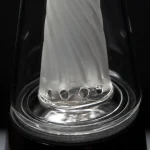 puffco peak glass wiidz original2.0 center close up shot.webp Close-up shot of the original 2.0 glass for Puffco Peak, showcasing its design and quality details, perfect for cannabis enthusiasts.