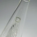 puffco peak glass wiidz original2.0 clear center top close up.webp Close-up view of the Puffco Peak Glass Wiidz Original 2.0 with a clear center, showcasing its intricate design and high-quality craftsmanship.