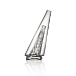 puffco peak glass wiidz original2.0 clear facing west.webp Puffco Peak Glass Wiidz Original 2.0 in Clear, showcasing a modern design ideal for vaporizing concentrates, with a scenic backdrop facing west.