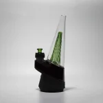 puffco peak glass wiidz original2.0 green installed facing east.webp Puffco Peak glass Wiidz original 2.0 in vibrant green color, expertly installed, positioned facing east, showcasing its sleek design and functional aesthetic for an enhanced dabbing experience.