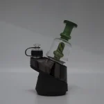puffco peak pro glass attachment WIIDZ pico green installed facing east.webp Puffco Peak Pro glass attachment WIIDZ Pico in vibrant green, expertly installed and oriented towards the east, showcasing its sleek design and functionality for enhanced dabbing experiences.