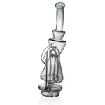 puffco peak pro glass attachment wiidz recycler facing north.webp Puffco Peak Pro glass attachment Wiidz recycler oriented north, showcasing its sleek design and functionality for optimal dabbing experience.