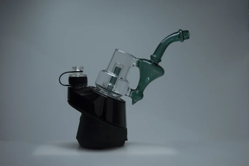 Puffco Peak Pro glass attachment Wiidz Sherlock in green installed facing east, showcasing its sleek design and functionality for an enhanced vaporization experience.