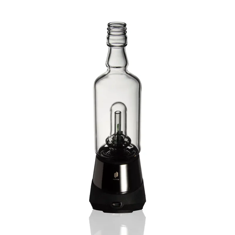 Puffco Peak Pro equipped with Wiidz Tipsy Black glass attachment, installed facing south, showcasing its unique design and casting a shadow.