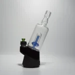puffco peak pro glass attachment wiidz tipsy blue installed facing east white background 1.webp Puffco Peak Pro glass attachment in Wiidz Tipsy Blue color installed, facing east against a clean white background, showcasing its sleek design and functionality for enhanced vaping experience.