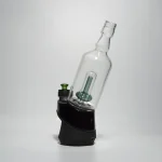 puffco peak pro glass attachment wiidz tipsy green installed facing south east white background.webp Puffco Peak Pro glass attachment in Wiidz Tipsy Green, installed facing southeast against a clean white background, showcasing its modern design and vibrant color.