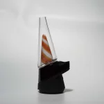 wiidz orange twist Puffco Peak Pro Glass Attachment installed facing west .webp Puffco Peak Pro glass attachment named Wiidz Orange Twist, installed facing west, showcasing a vibrant orange design that enhances the aesthetic and functionality of the vaporizer.